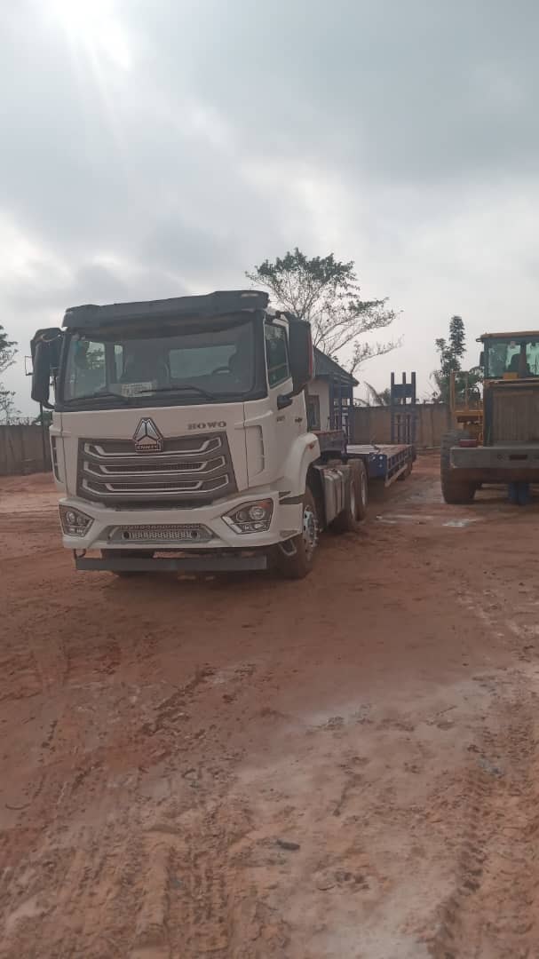 HOWO truck configured for low-bed equipment transport